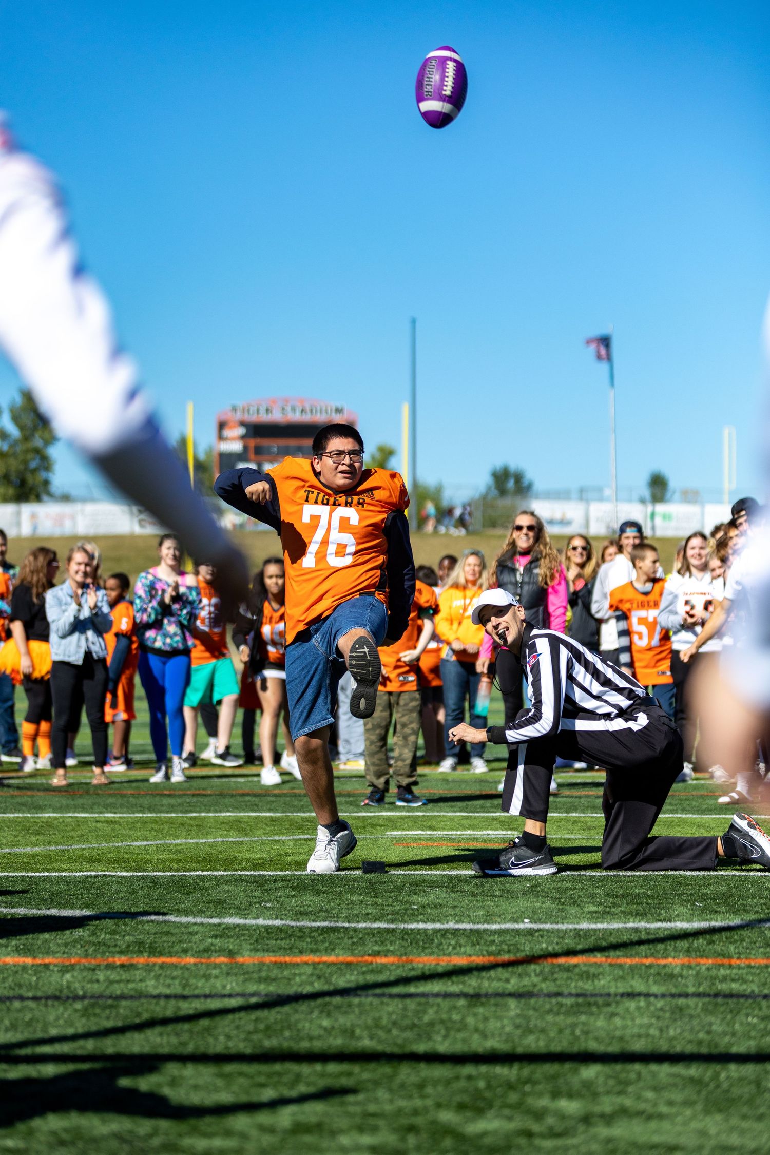 Students make the tunnel of high fives for special needs students