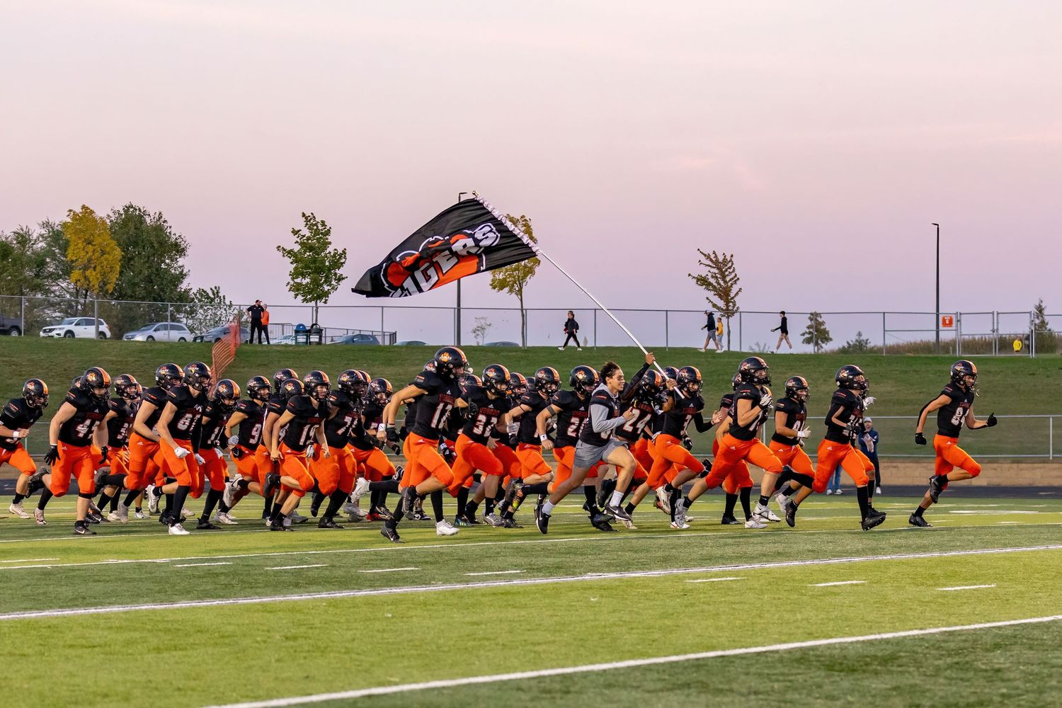 farmington tigers players storming center field