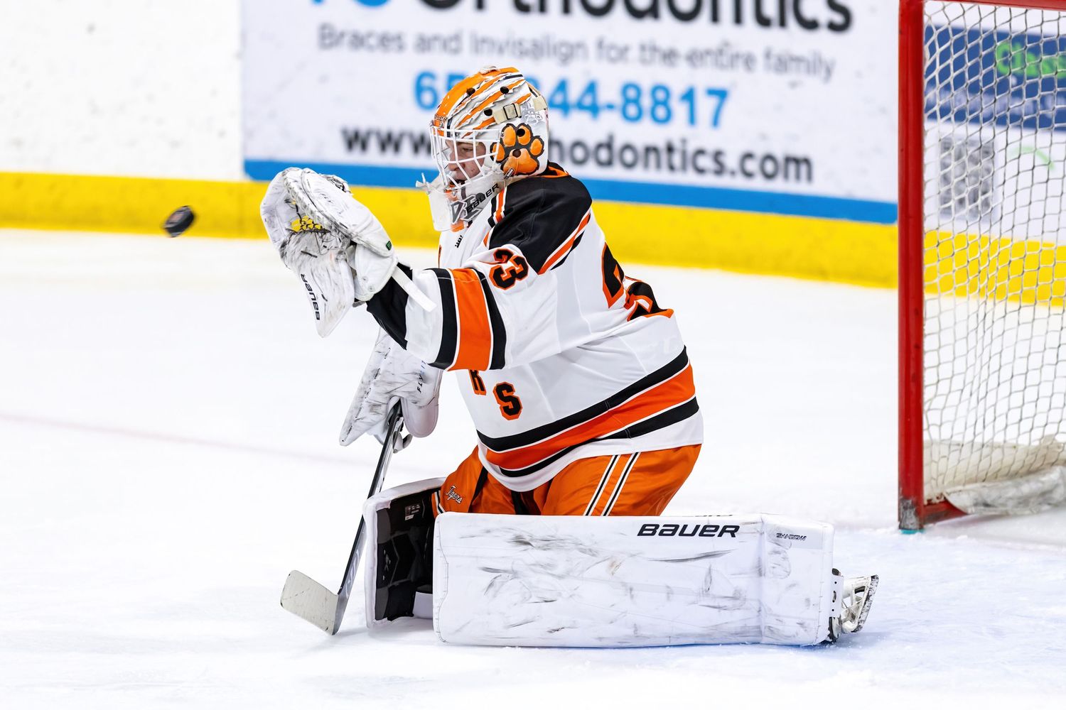Farmington Tigers boys hockey player makes the save on a hard angle shot