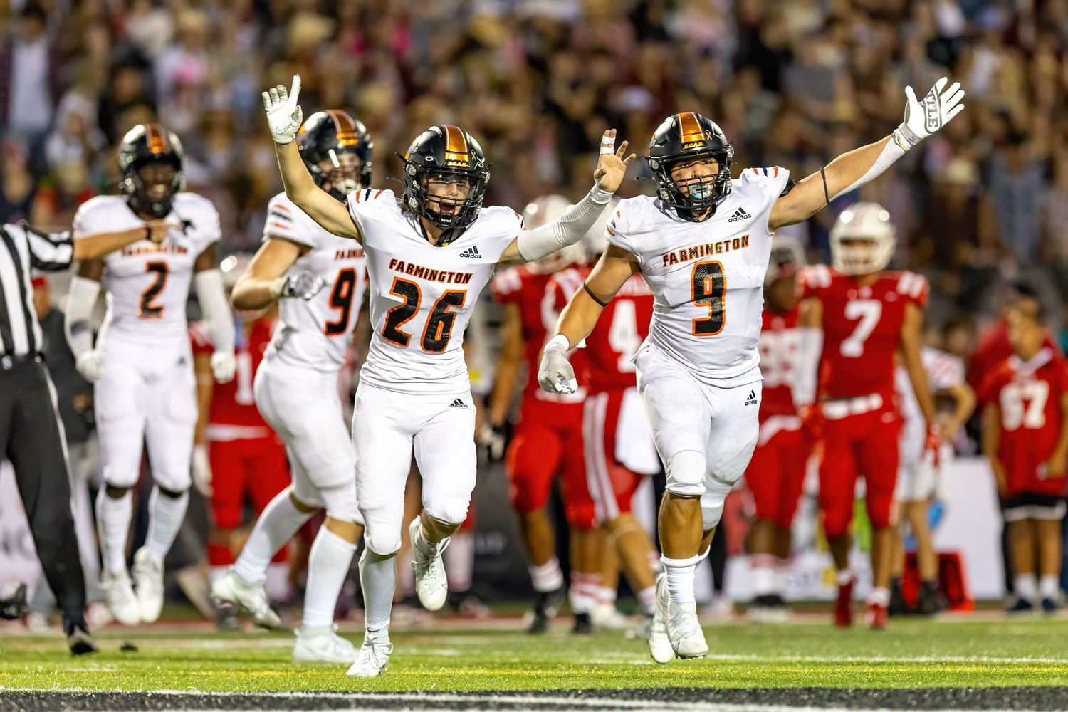 farmington tigers defense celebrates fumble recovery