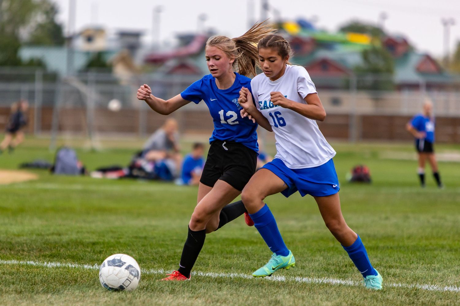 eastview high school girls soccer player battles for control of ball