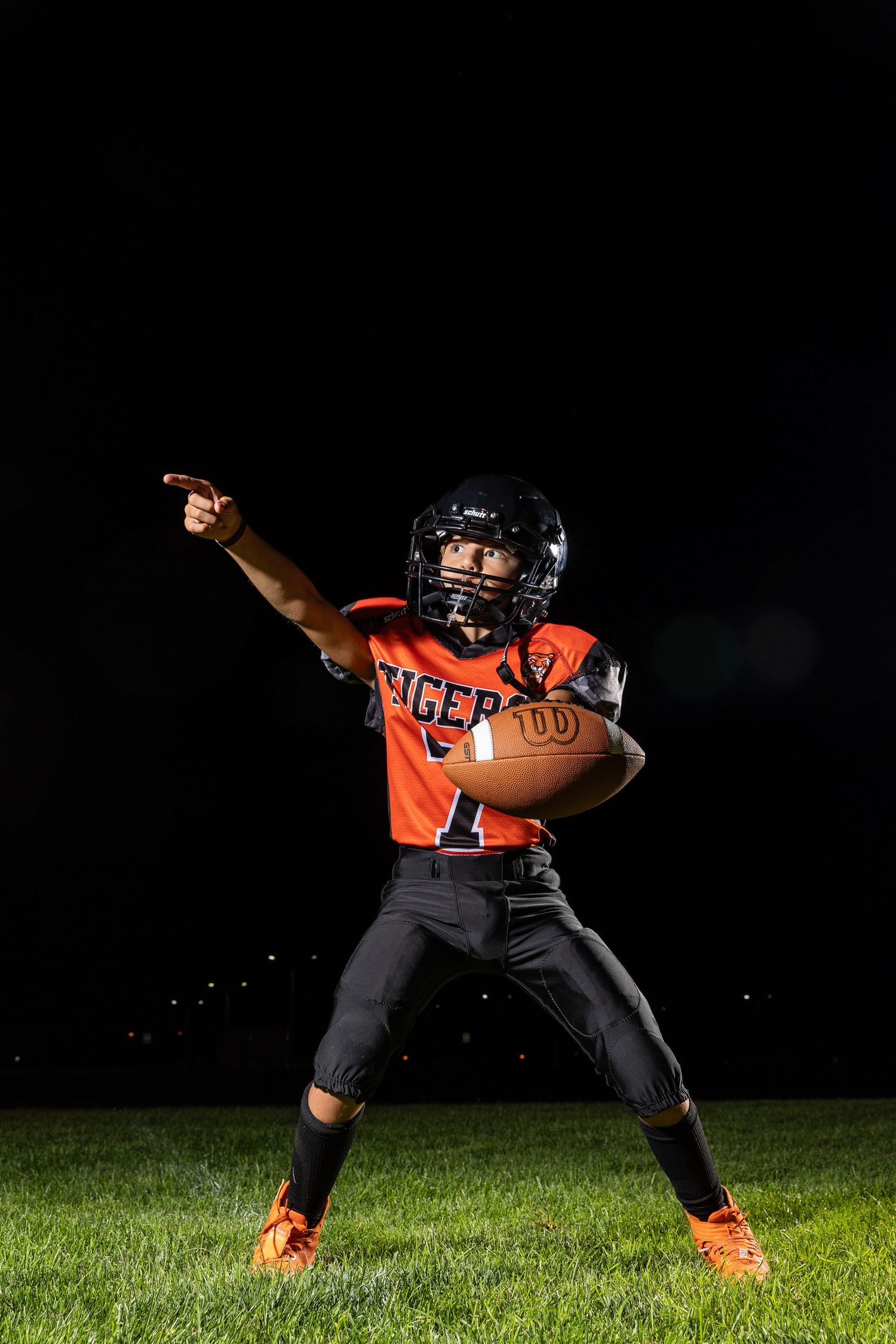 Farmington Tigers youth football player dynamic lighting sportrait twin cities sports photographer Brody Verch-Brown