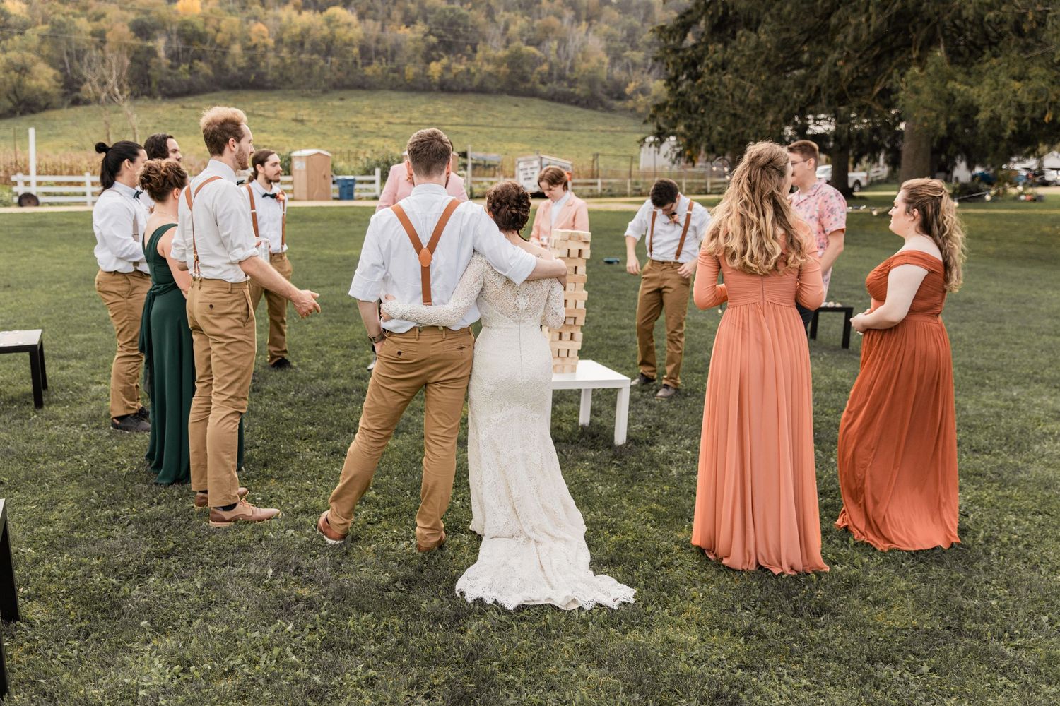 bride and groom speaking with their wedding party prior to ceremont