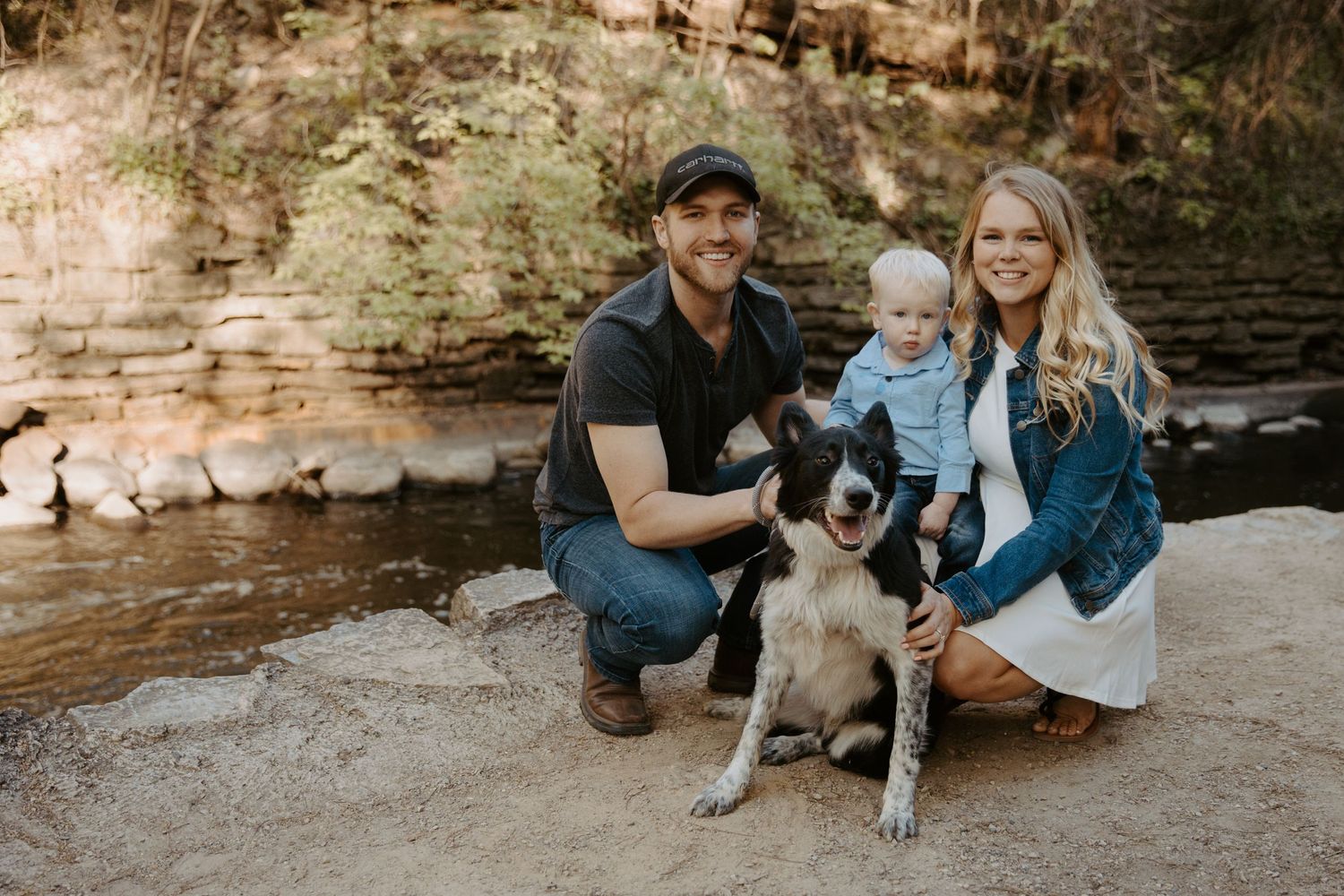 gorgeous young family with a little boy and their dog