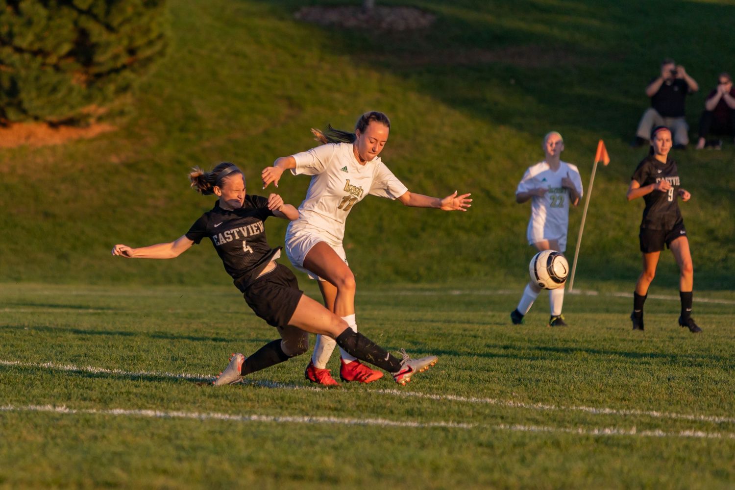 eastview high school girls soccer player reaches to put the ball on goal