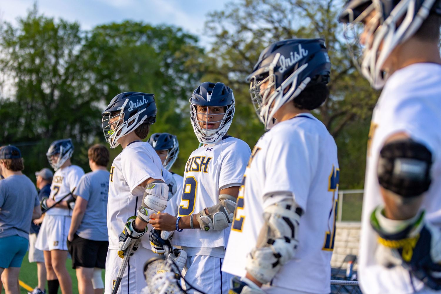 Rosemount Irish lacrosse players on the sideline