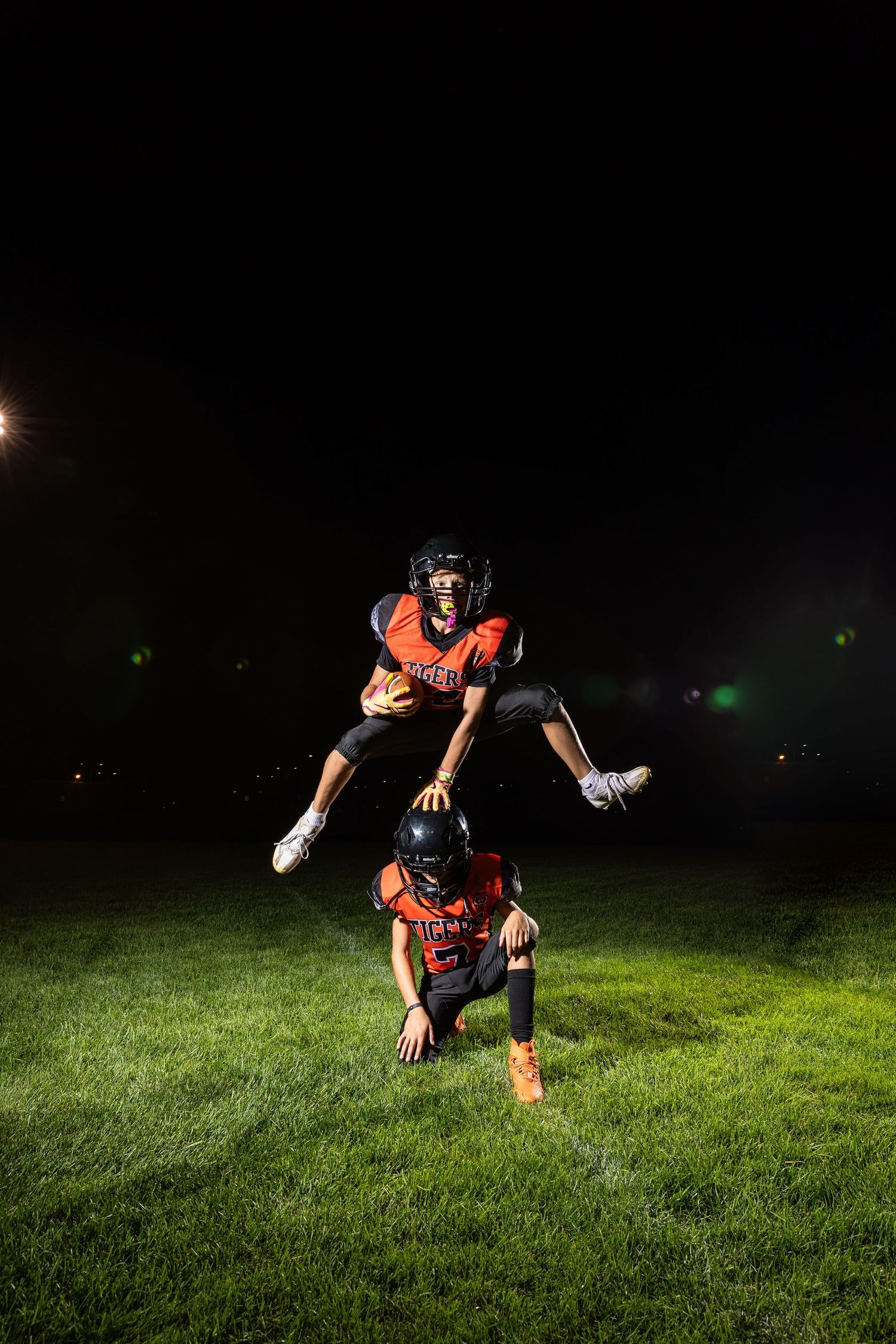 Farmington Tigers youth football player dynamic lighting sportrait twin cities sports photographer Henry Christensen Brody Verch-Brown