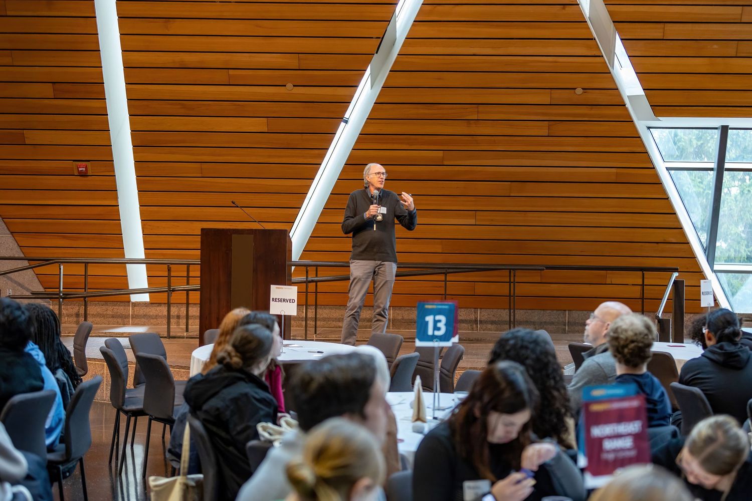 Expert speaker gives their presentation to a packed room in the McNamara Alumni Center for the Student Expo