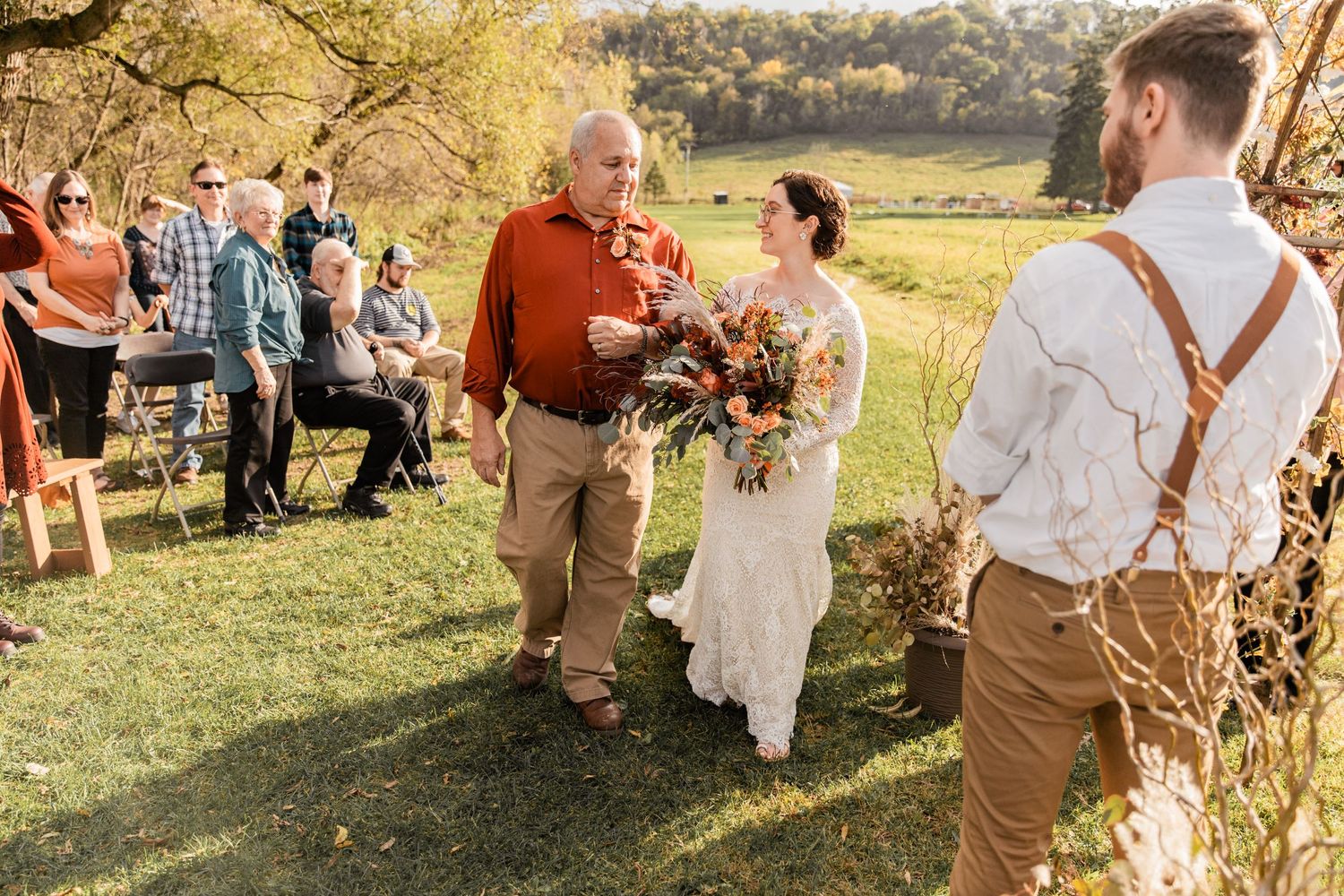 bride's step father gives her away to her groom