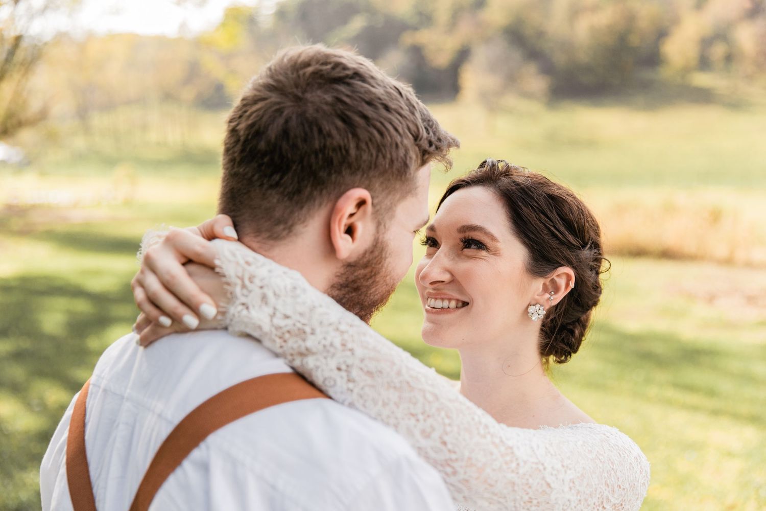 bride and groom embrace each other before their ceremony