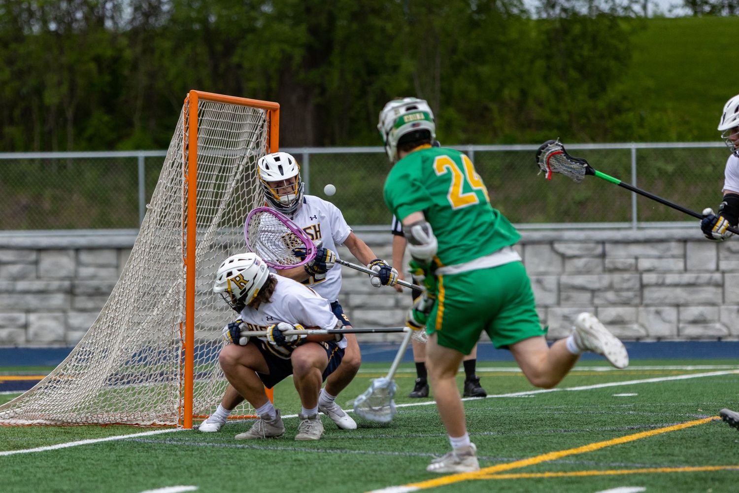 Rosemount Irish lacrosse goalie makes a save on a shot