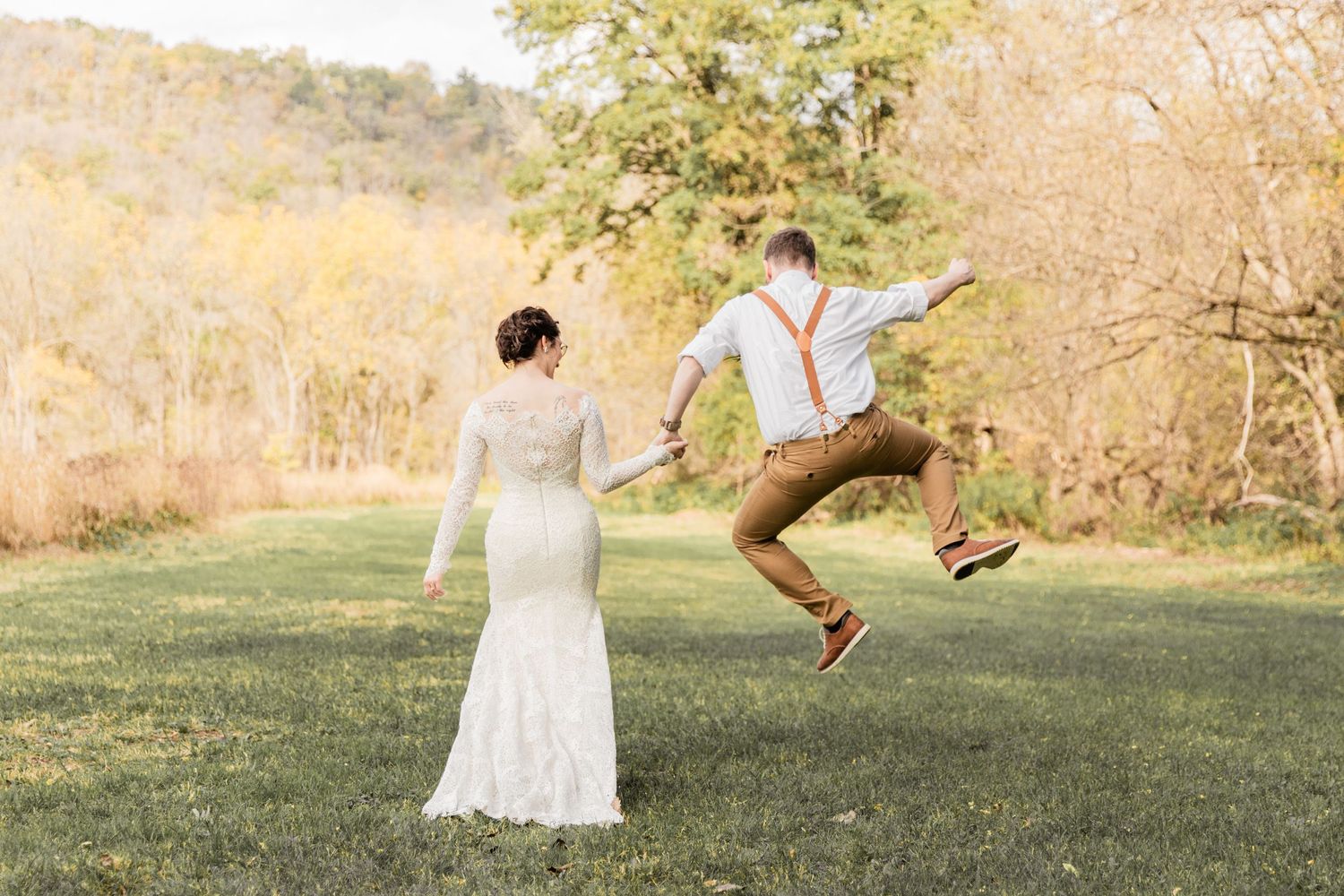 groom clicks his heels with excitement on their big day