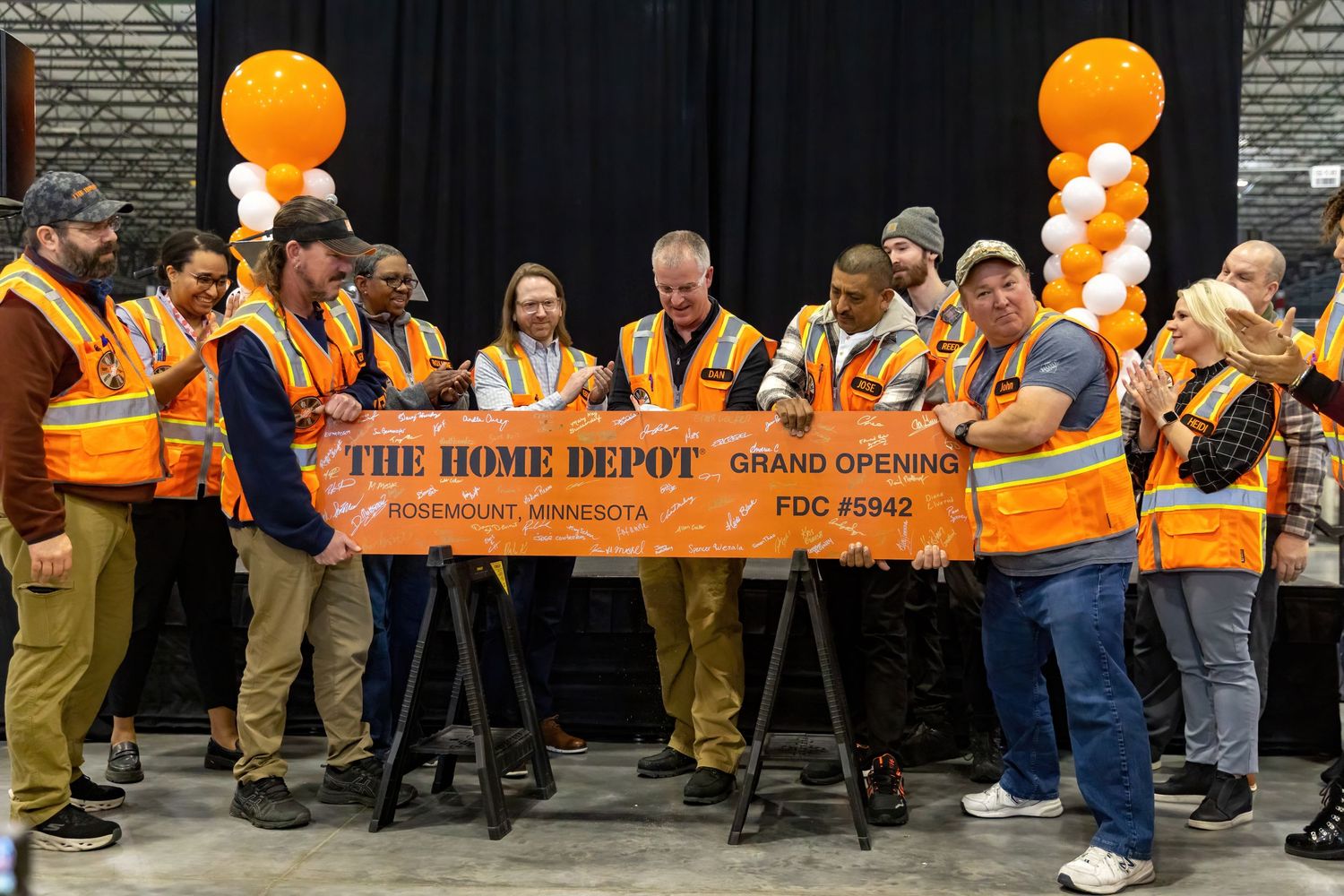 Managers and city officials cut the ribbon on a new Home Depot shipping warehouse in Rosemount