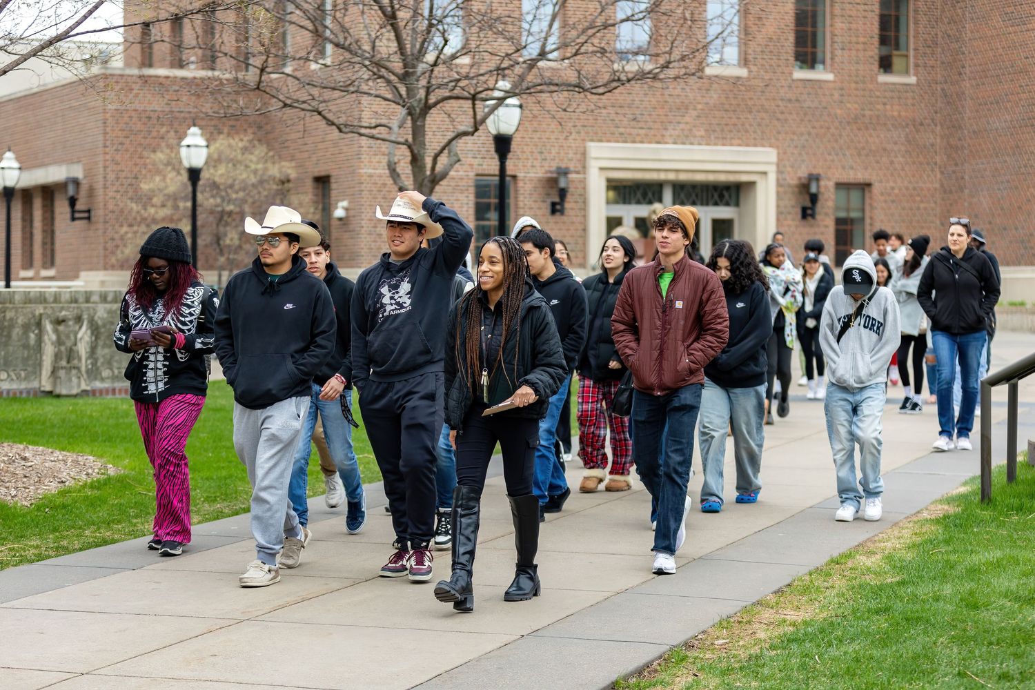 University of Minnesota faculty giving a campus tour to the East Bank campus