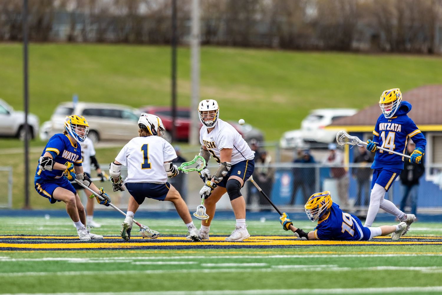 rosemount irish boys lacrosse keeping eye on ball against wayzata