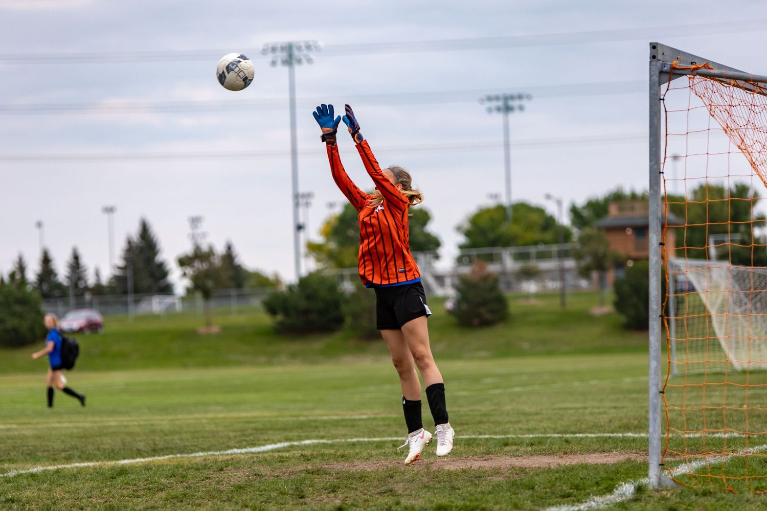 eastview high school girls soccer goalie jumps to make the save
