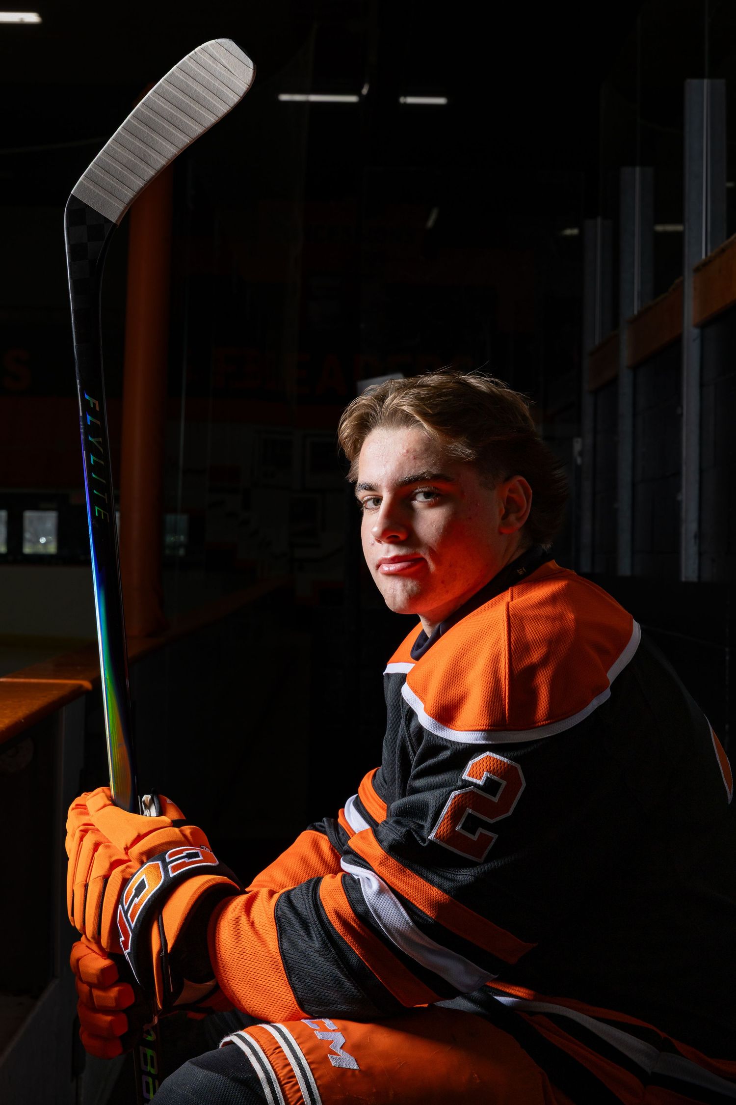 Farmington Tigers boys hockey player gives his best  mean face pose on the bench for media day