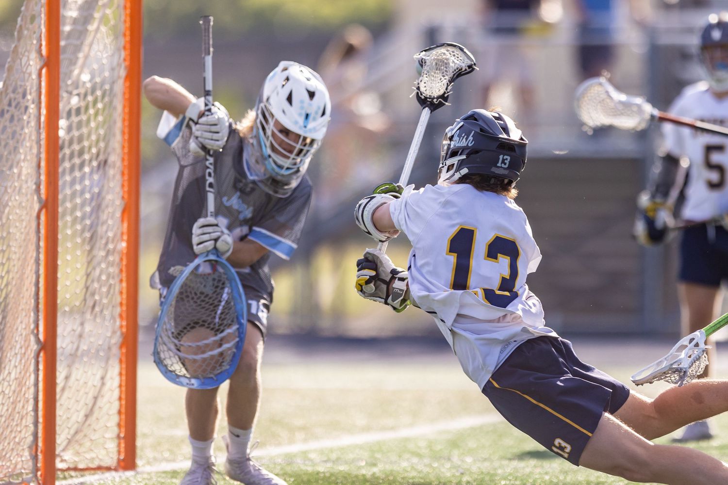 rosemount irish boys lacrosse player makes diving shot on goal