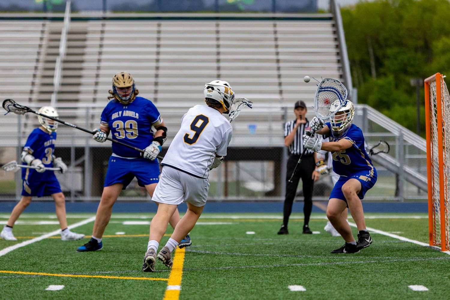 Rosemount Irish lacrosse player scores a goal on a wide open net