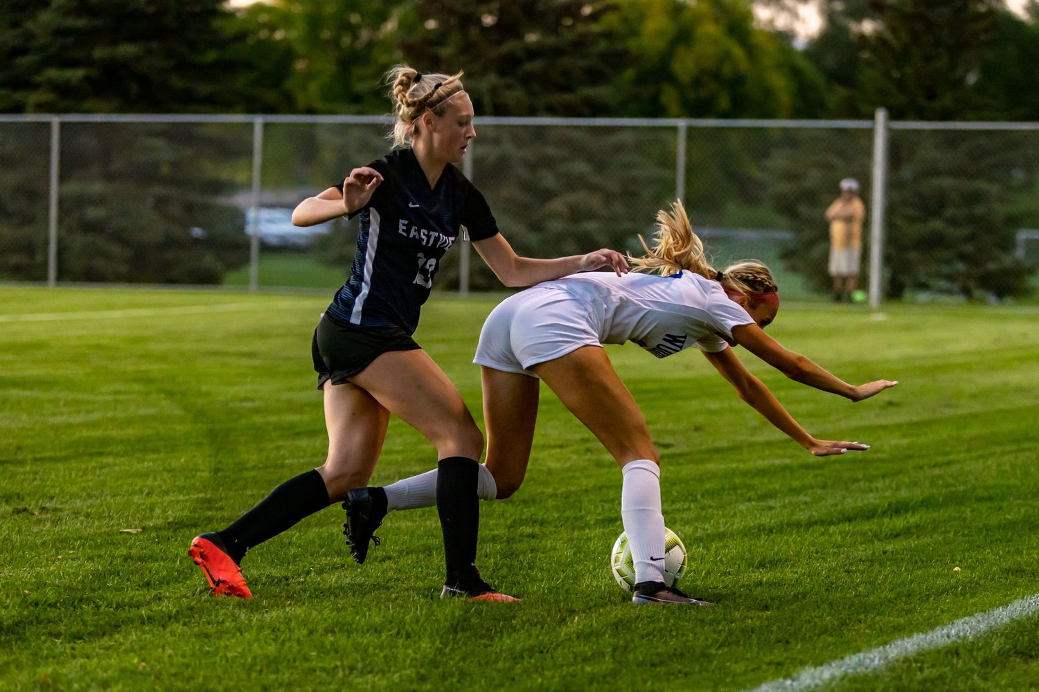 eastview high school girls soccer player gives defender a little shove