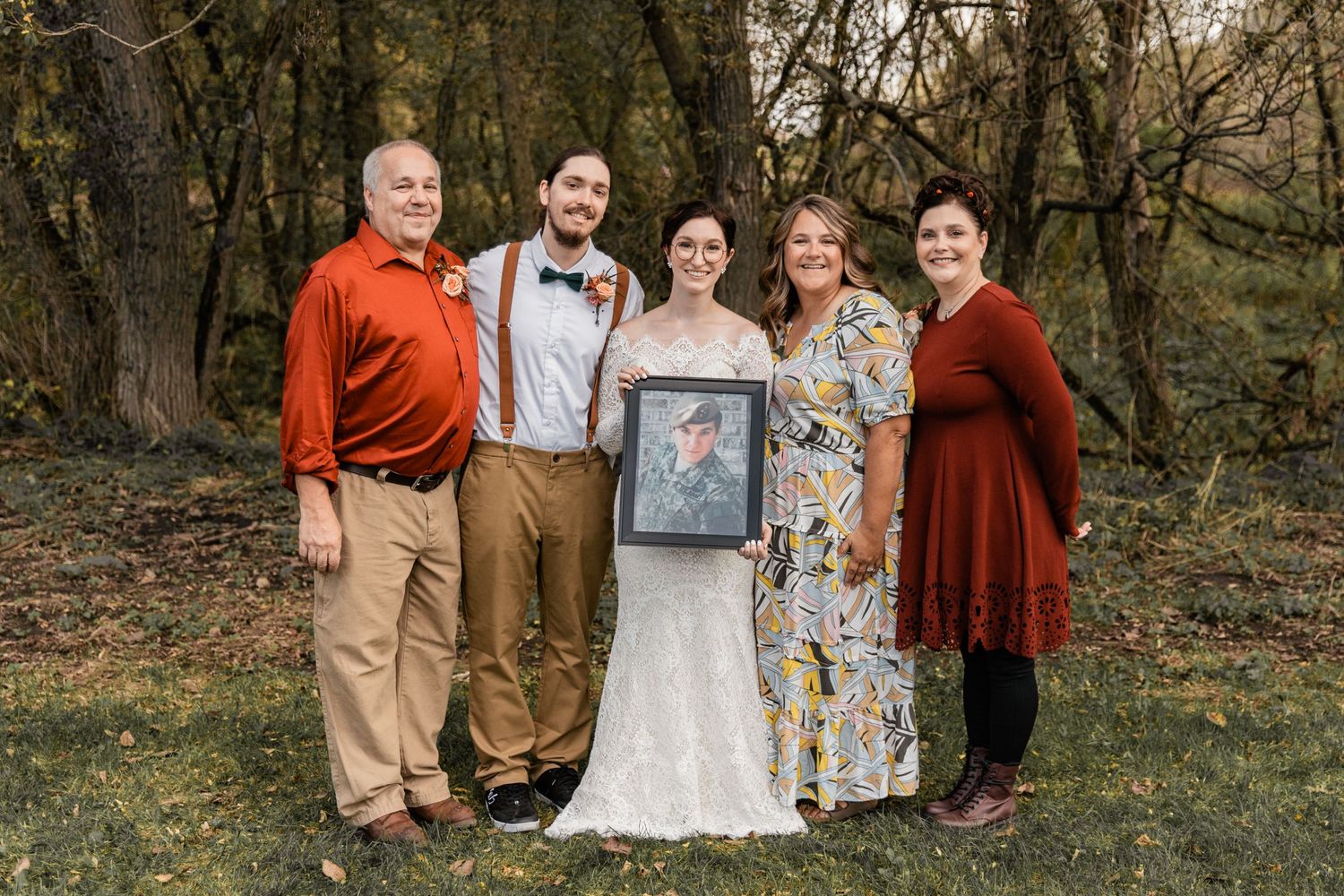 bride with her family and photo of her fallen step brother