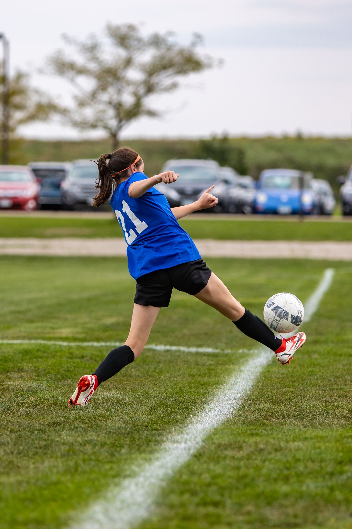 eastview high school girls soccer player extends to keep ball in play