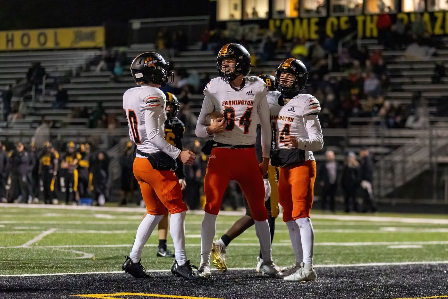 farmington tigers tight end celebrates big touchdown in the rain against burnsville blaze