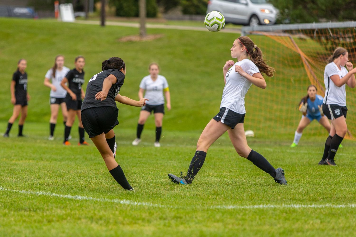 eastview high school girls soccer player takes free kick on goal