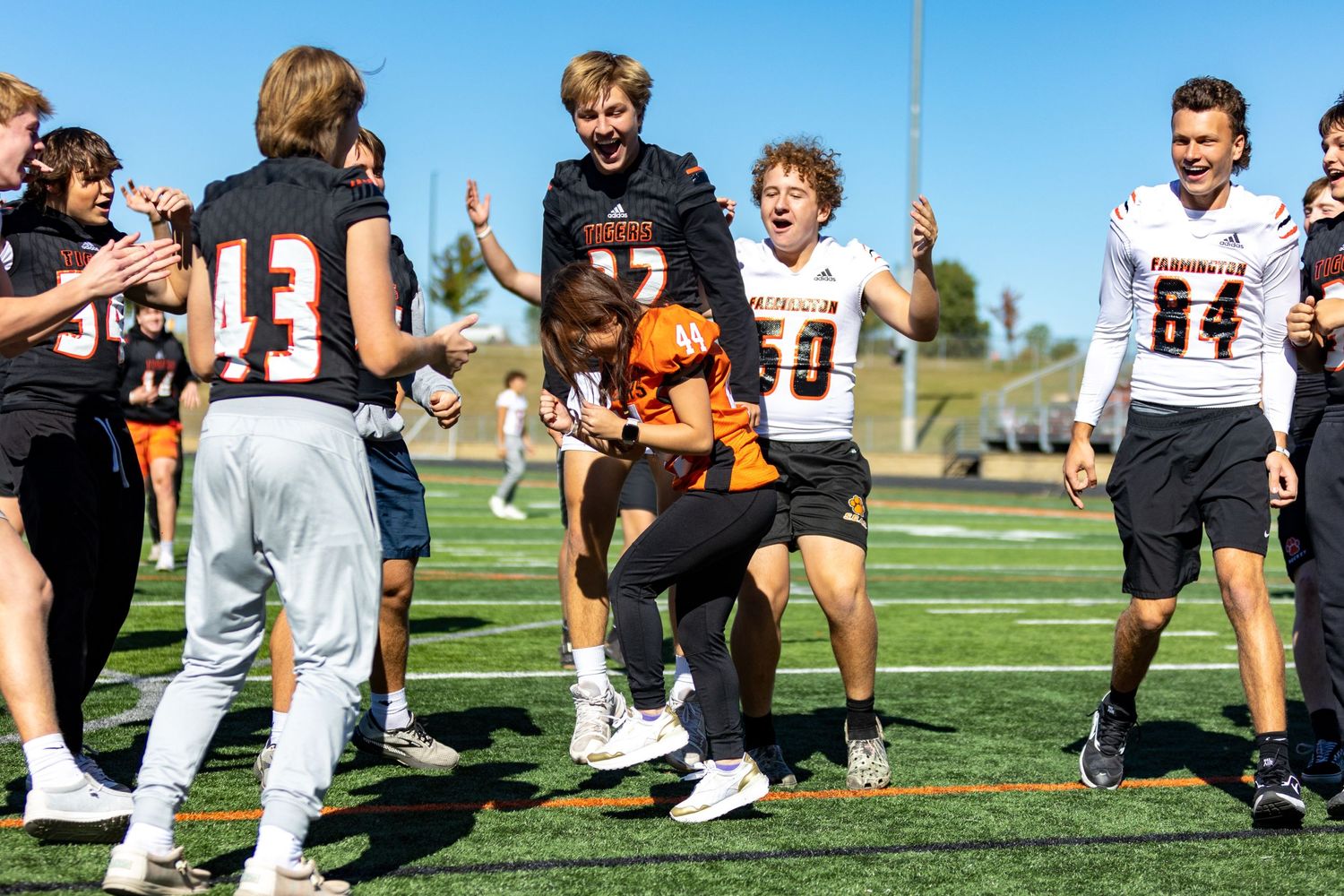Students make the tunnel of high fives for special needs students