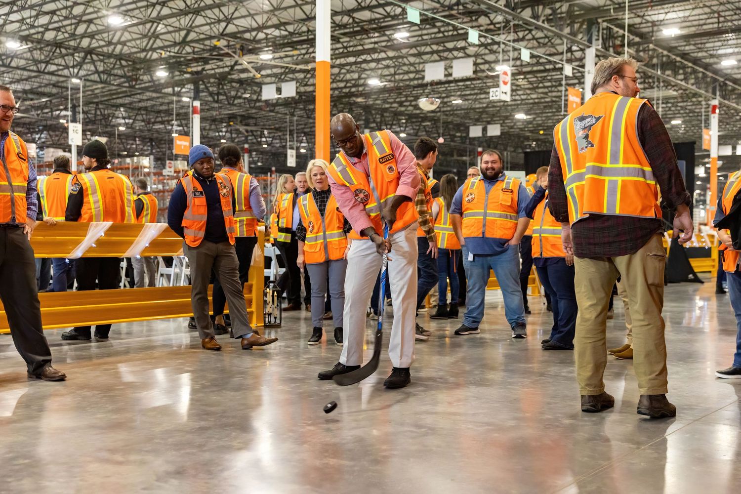 Home Depot employees celebrating the opening of a new shipping warehouse in Rosemount