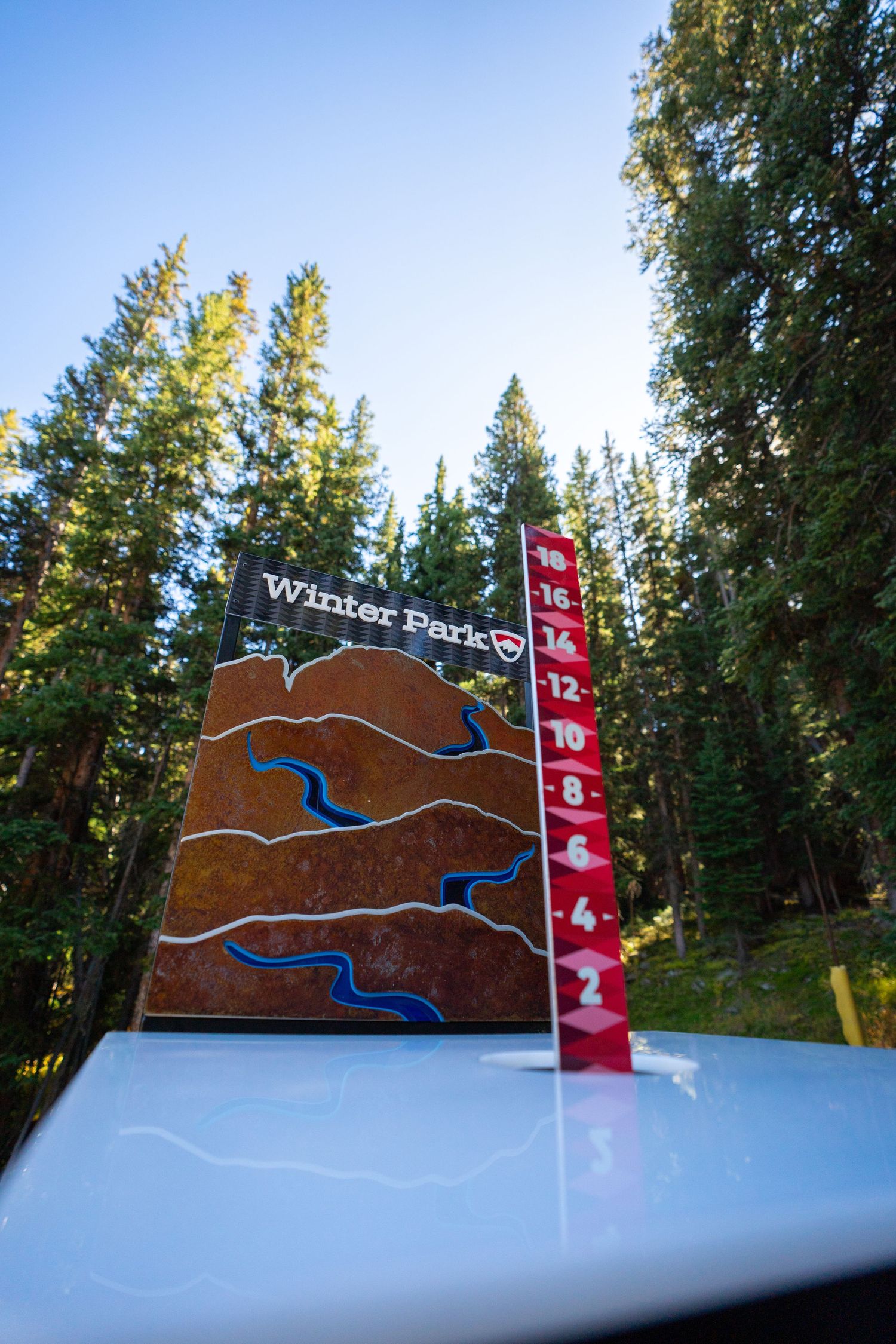 Winter Park trail map display with elevation markers in forest setting.
