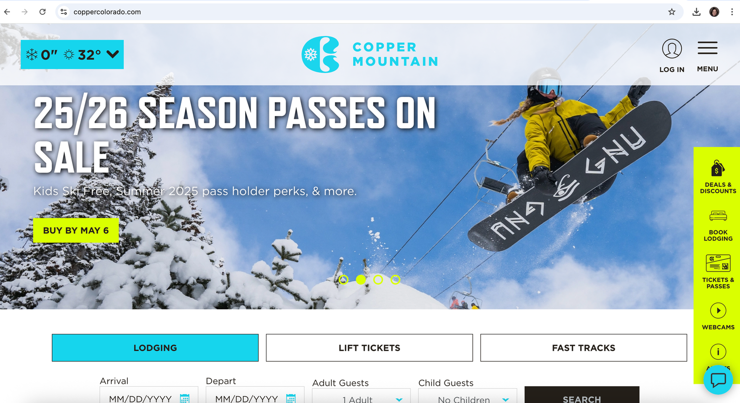 Snowboarder performing aerial trick against snowy mountain backdrop with website header promoting season passes.