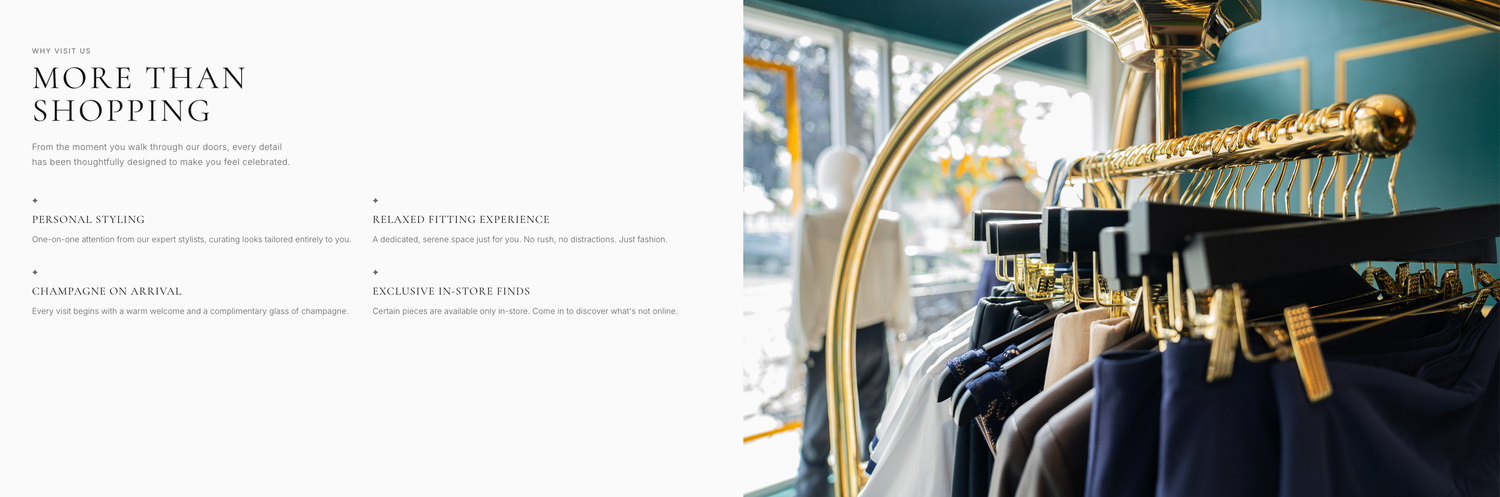 Elegant clothing boutique with gold rack displaying tailored suits and jackets in a stylish teal interior.