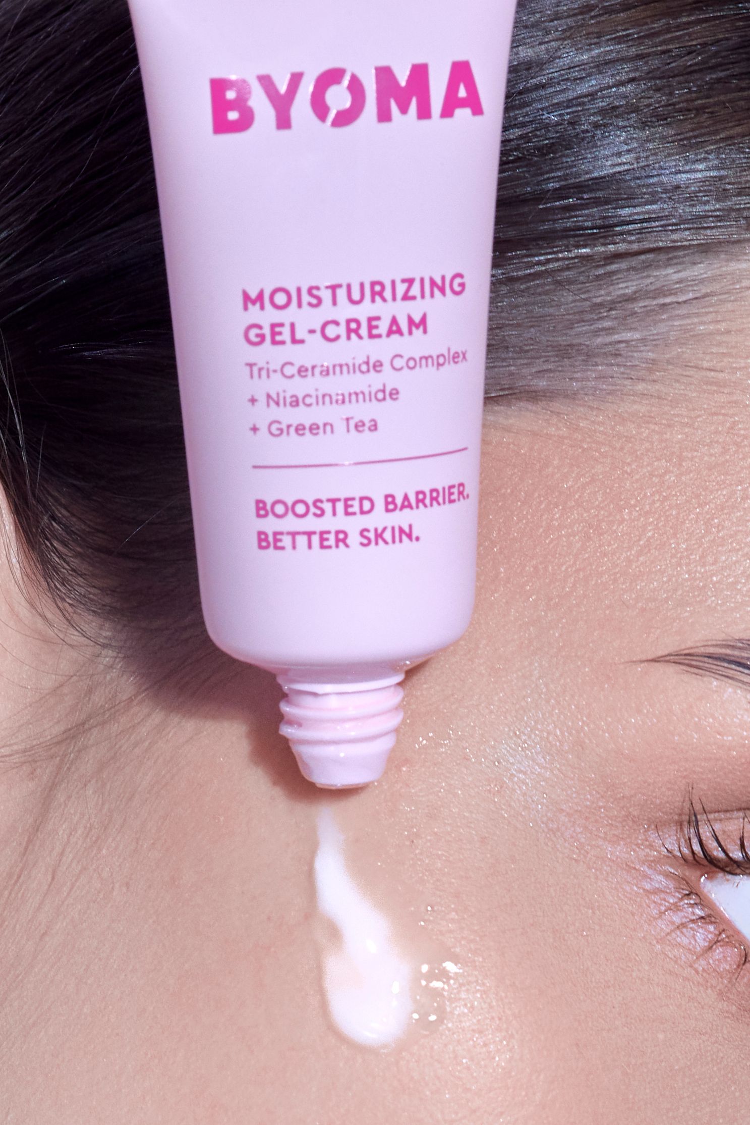 BYOMA Moisturizing Gel-Cream with Tri-Ceramide Complex, Niacinamide, and Green Tea being dispensed from a pink tube.