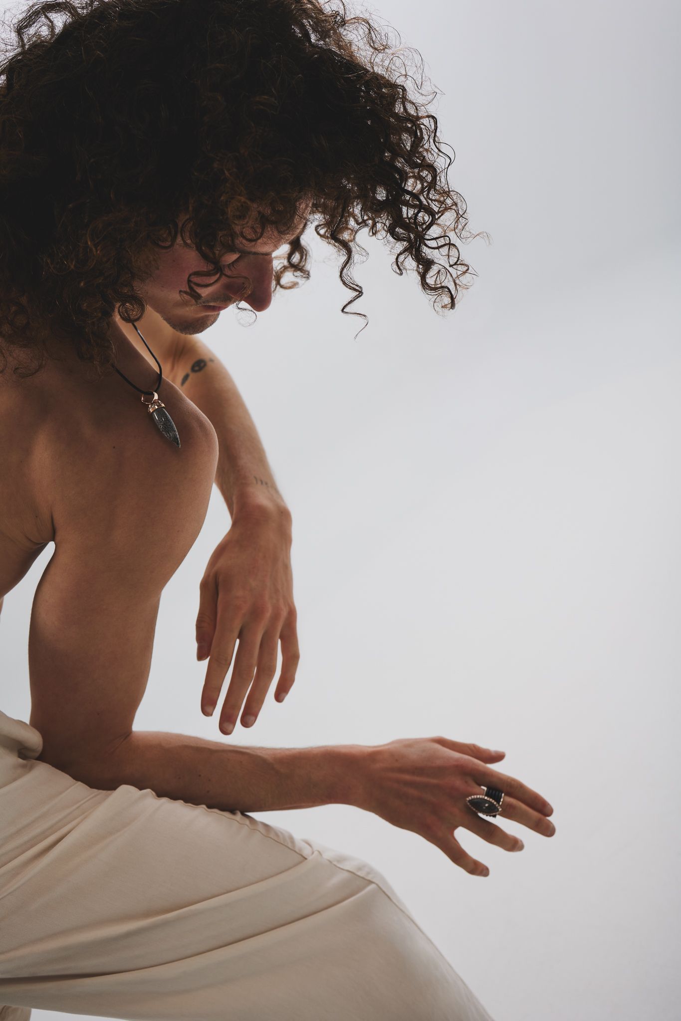 Artistic sequence of hands in motion against a white background, emphasizing expressive gestures and flowing movement.
