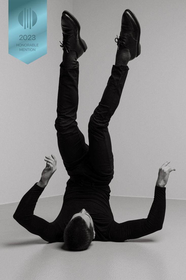 A series of black and white photos showing someone falling down in slow motion against a plain background.