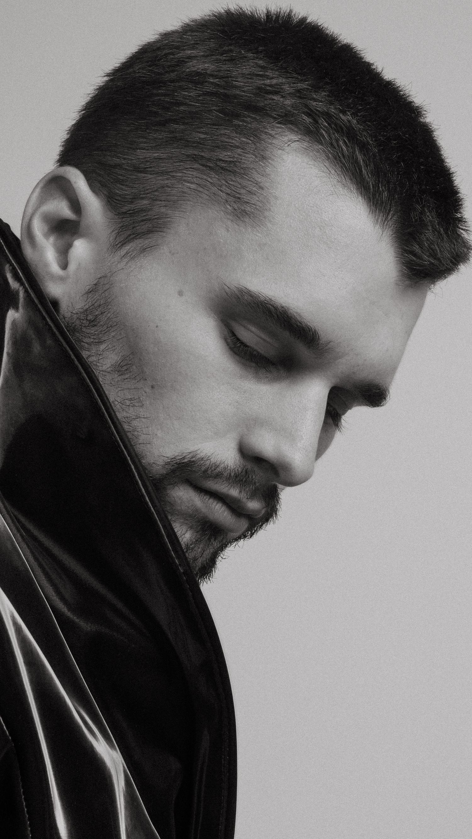 Black and white artistic portrait series showing profile views wearing black turtleneck against plain background.