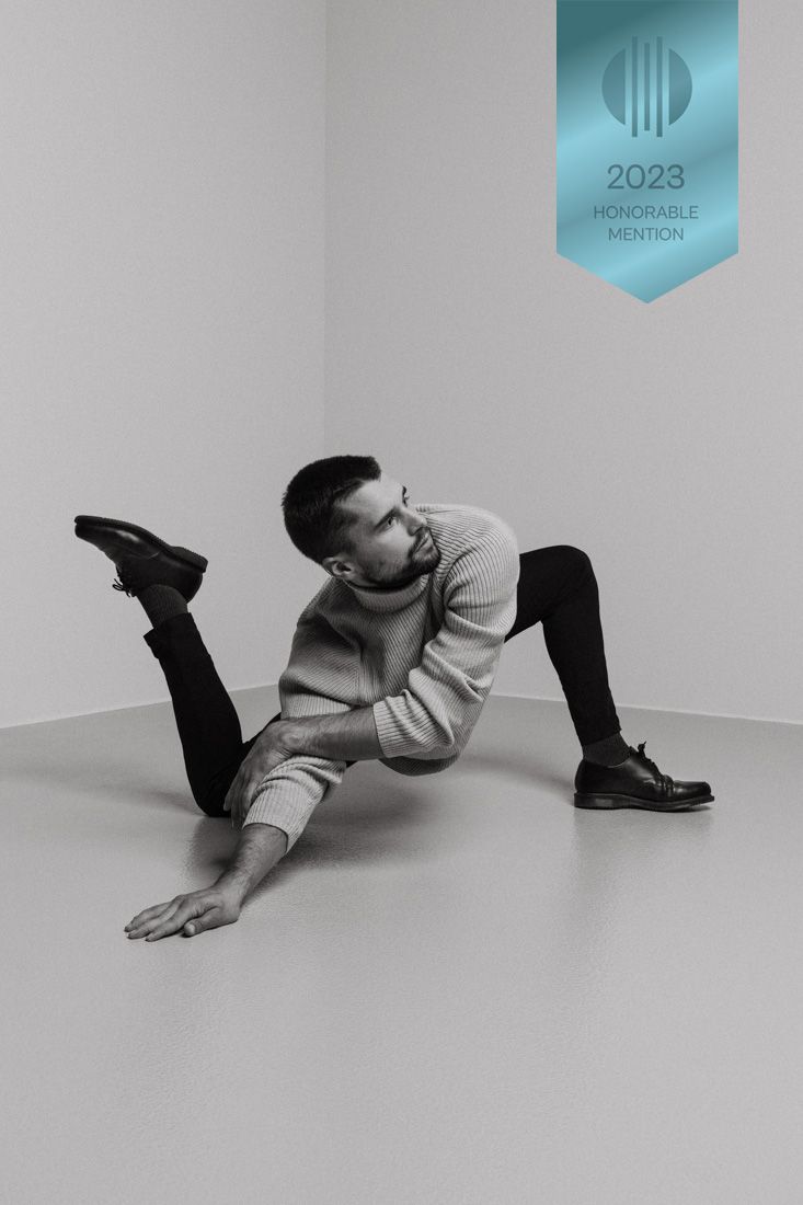 Artistic black and white photo series showing person lying on ground in various dynamic poses against minimal backdrop.