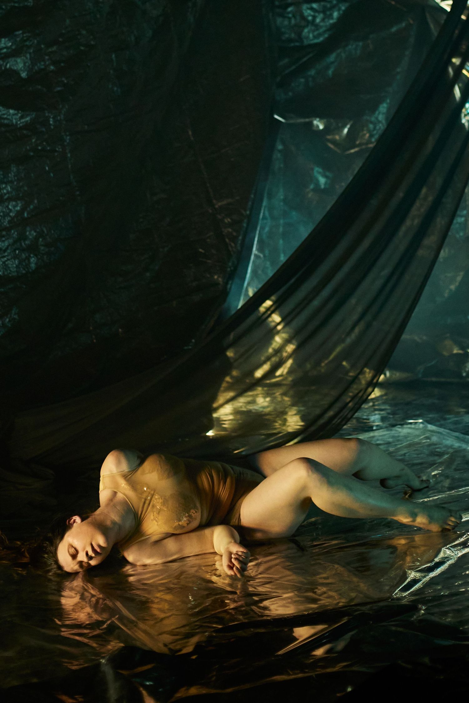 Artistic dark fantasy scene in moody green-tinted water with dramatic lighting and reflective surfaces.