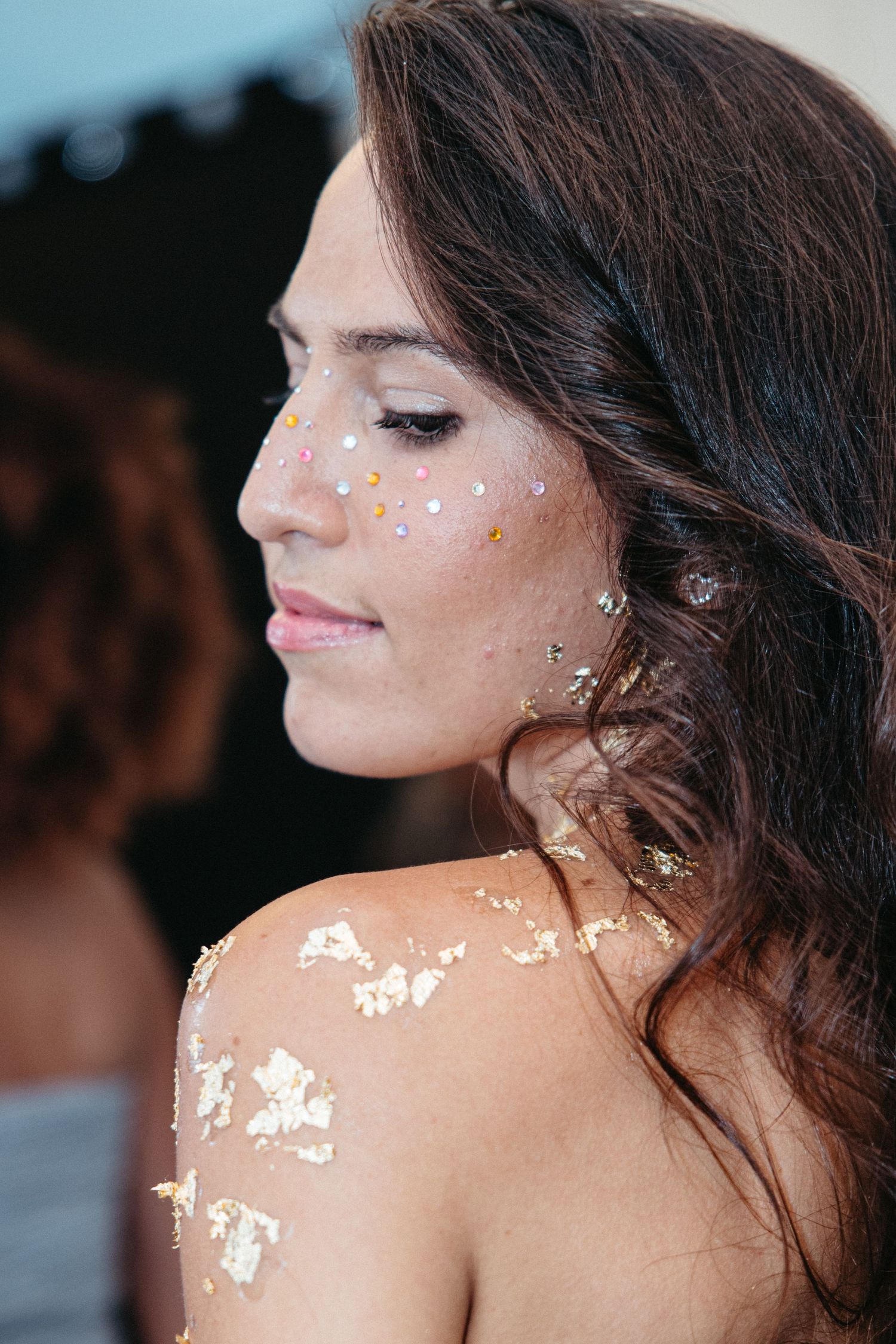Close-up images showing woman with glitter around eyes and glowing skin in artistic beauty photoshoot sequence.
