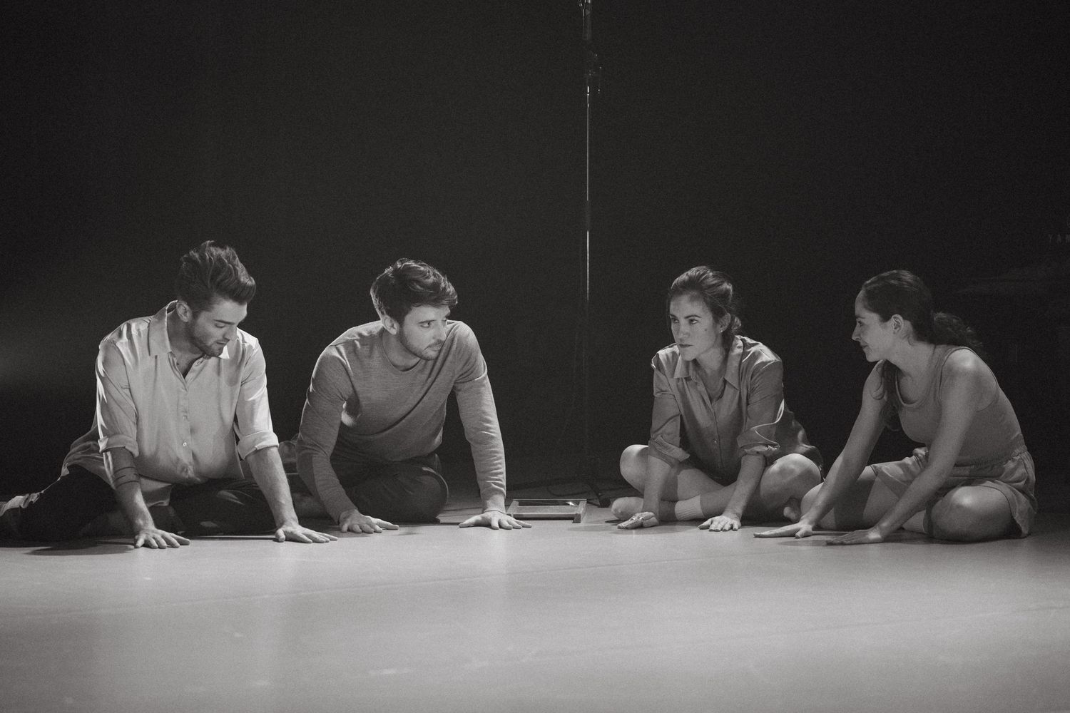 A sequential black and white photo showing multiple people sitting at a table writing or studying.