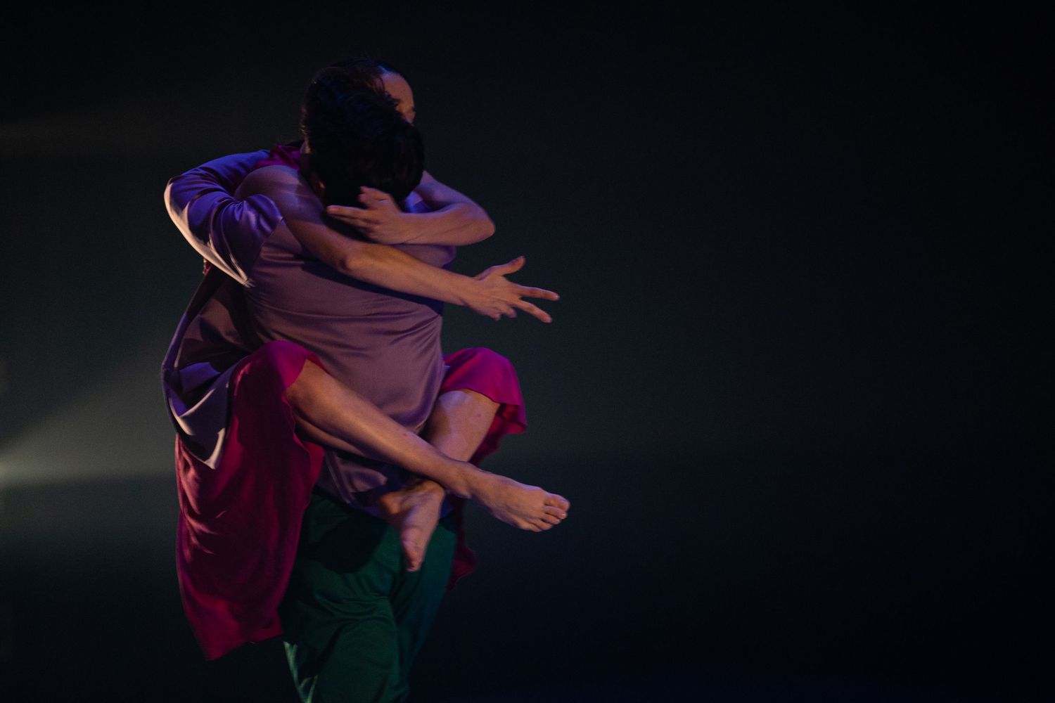 Figure in a dimly lit room performs dynamic dance movements in a sequence shown across multiple frames.