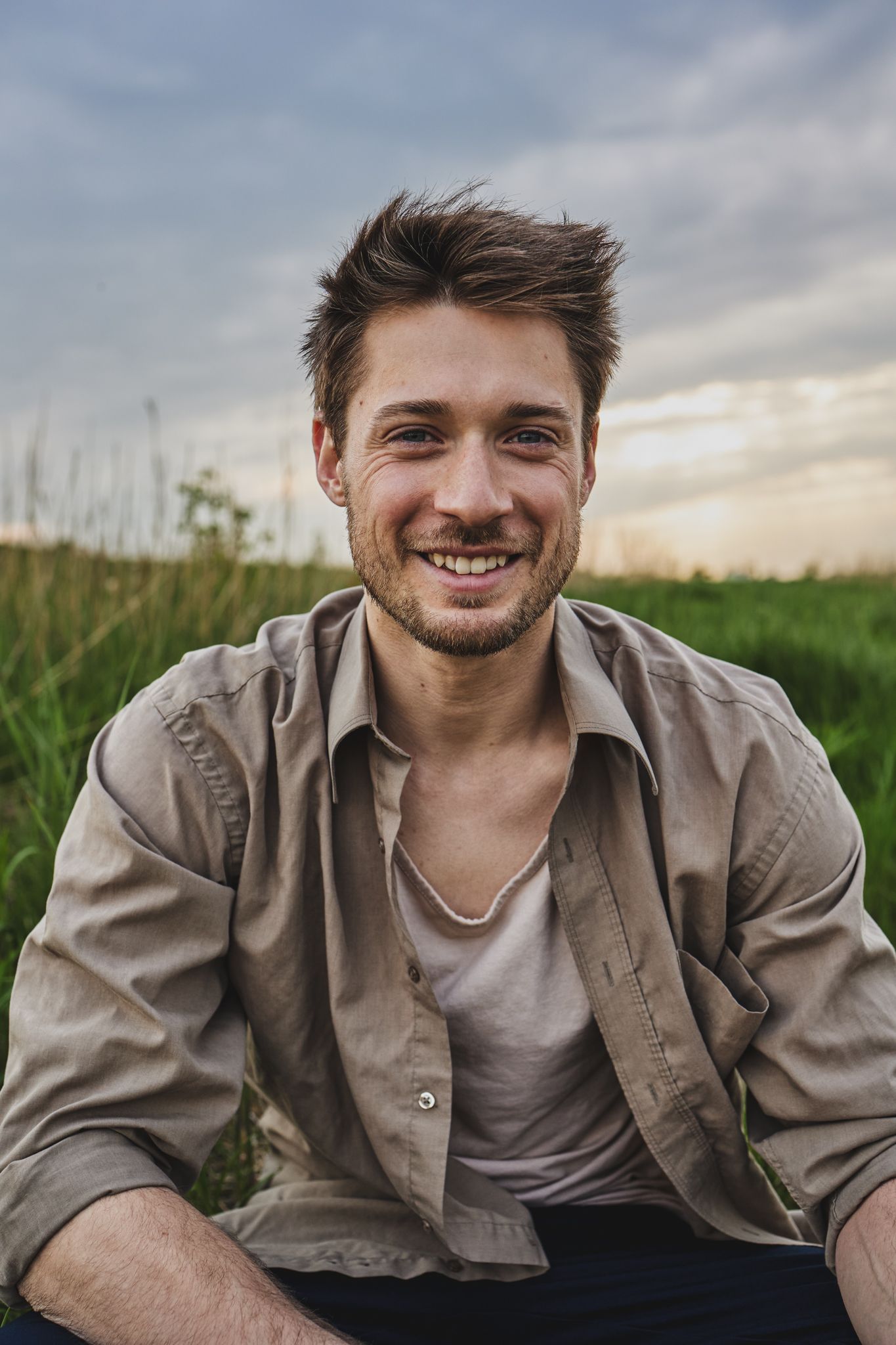 A candid portrait series showing genuine expressions and emotions in an outdoor natural setting.