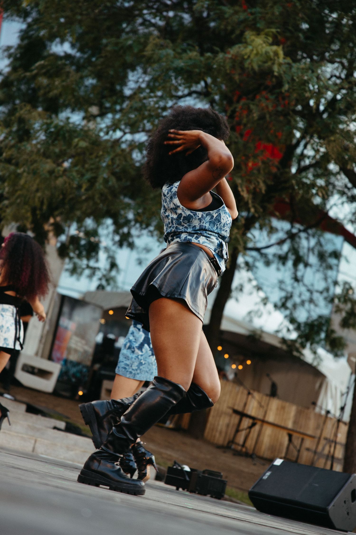Dynamic sequence showing a person performing aerial tricks on rollerblades in an urban setting at sunset.