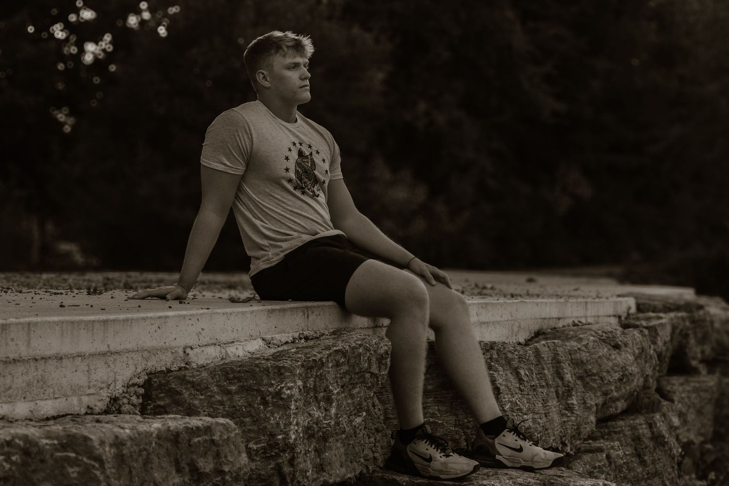 Black and white artistic portraits taken on stone steps in natural lighting.