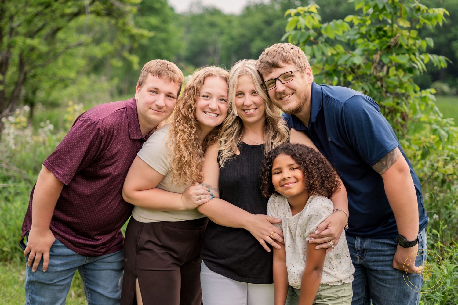 Series of casual group portraits taken outdoors with greenery in the background.