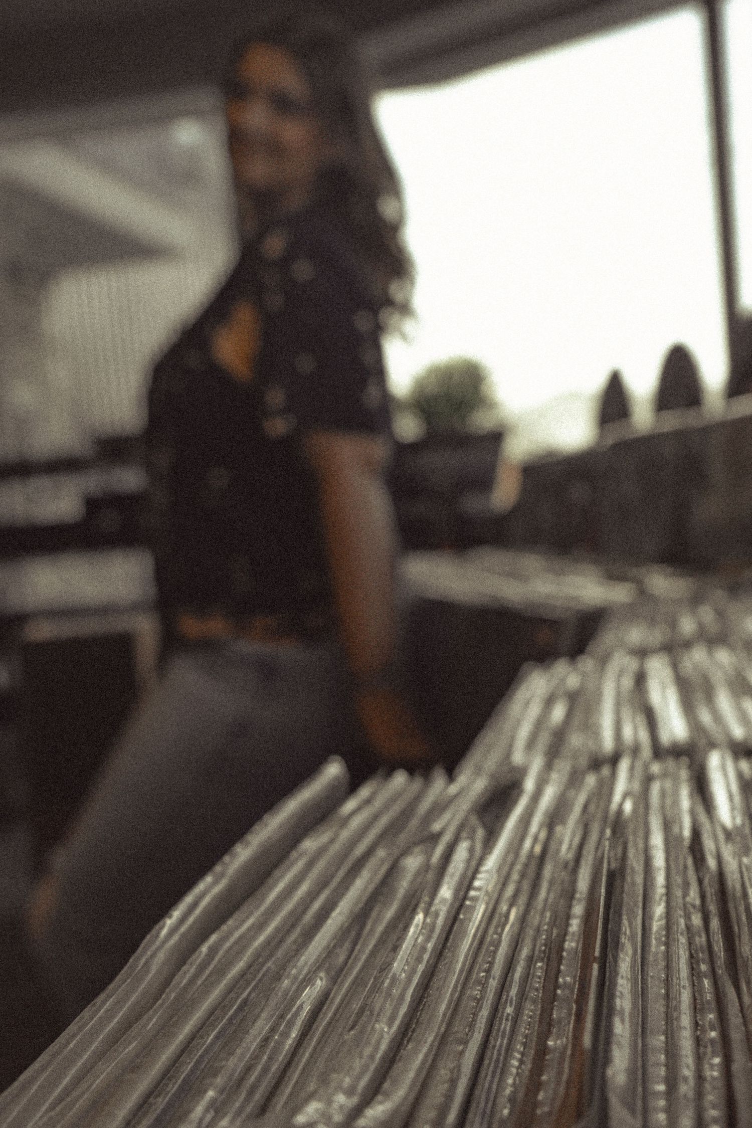 Close-up view of vinyl records arranged in rows on display.