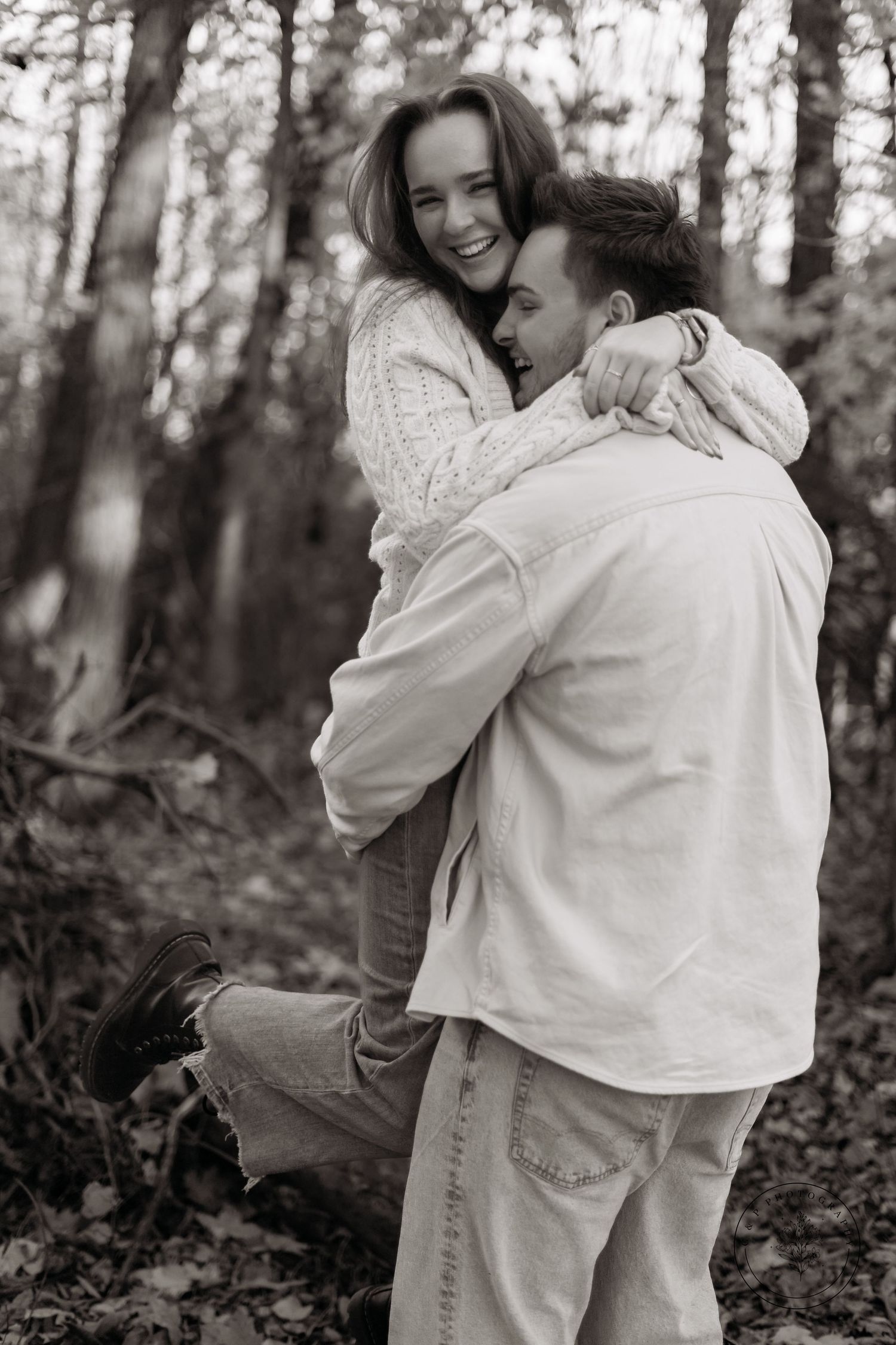 Black and white portrait series showing intimate embraces and laughter in a wooded setting.