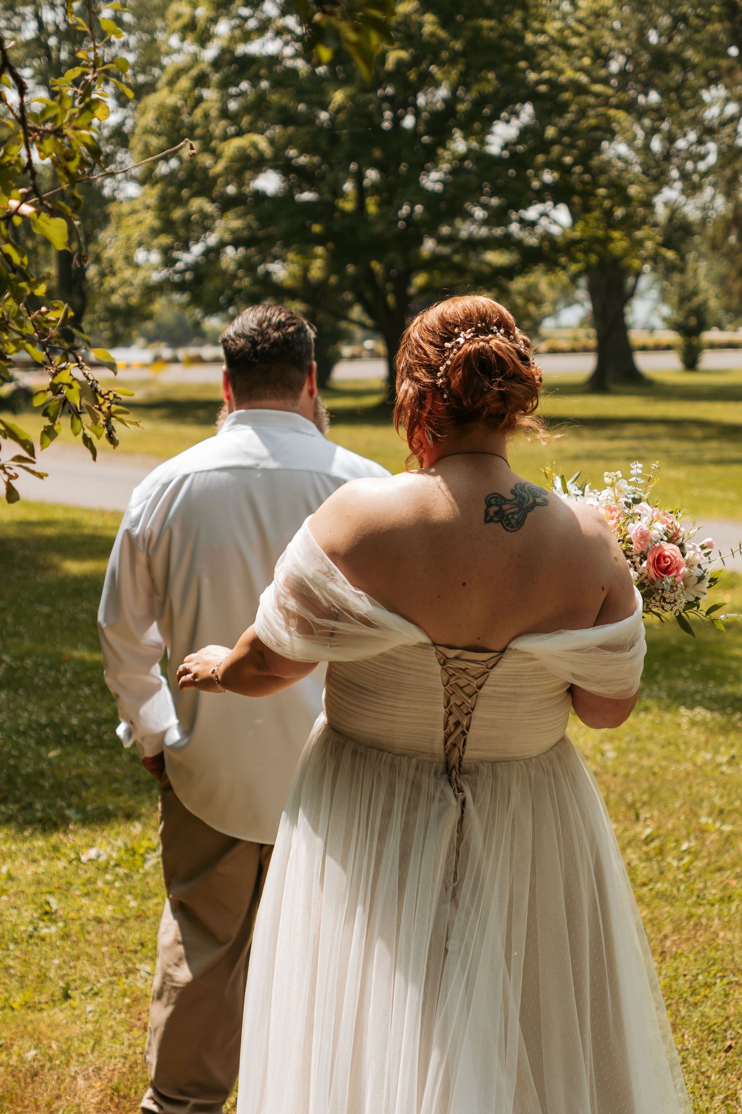 Series of wedding photos showing couple walking together in a lush outdoor garden setting with sunlit trees in background.