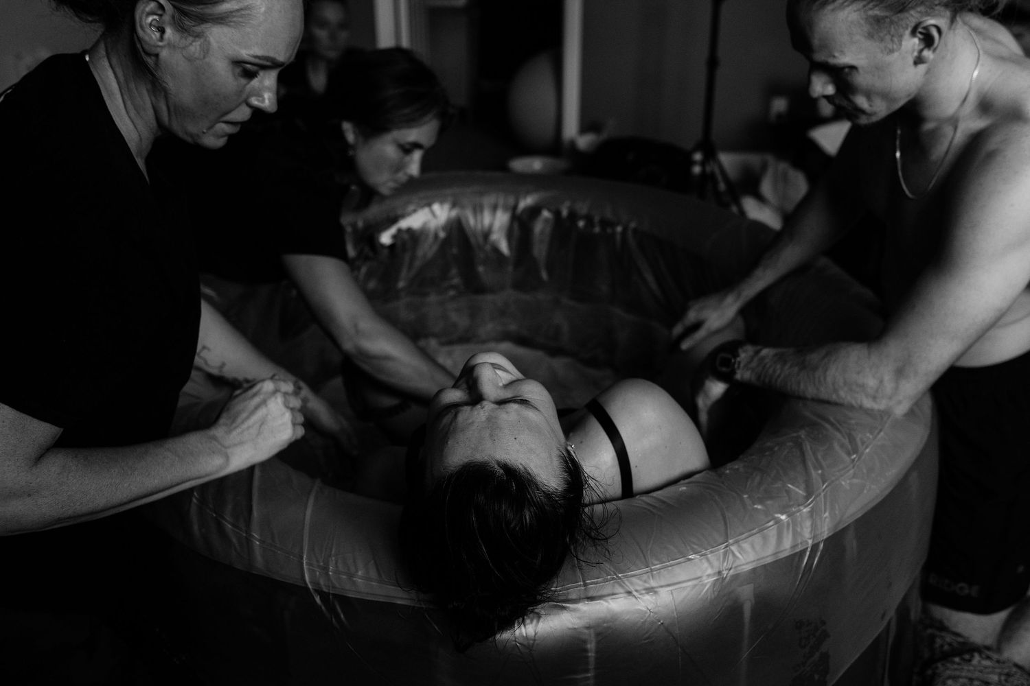 Dramatic black and white photographs capturing emotional moments during a medical procedure.